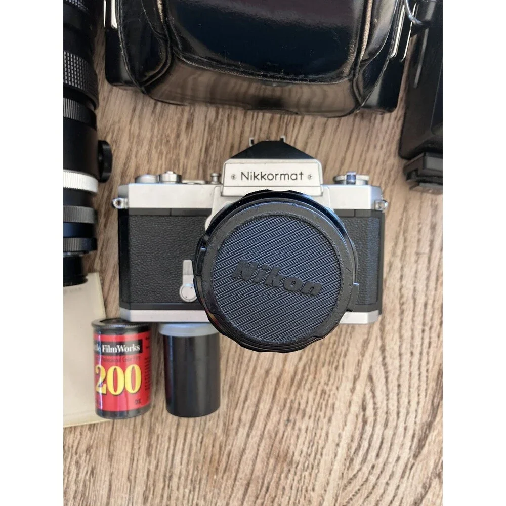 Nikon Nikkormat FTN 35 mm Camera with Additional lens, leather cases, & extras